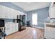 Bright eat-in kitchen boasts ample counter space, modern appliances, and updated flooring, ideal for culinary enthusiasts at 31 S Hinman St, Columbus, IN 47201