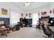 Large office area with two-tone walls, work stations, an arcade game, and neutral carpet at 31 S Hinman St, Columbus, IN 47201
