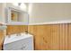 Clean and functional powder room with a modern vanity and wood-panelled walls at 31 S Hinman St, Columbus, IN 47201