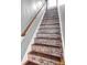 Unique staircase design featuring stone-like accents and wood trim, adding a touch of rustic charm to the home at 31 S Hinman St, Columbus, IN 47201