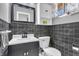 Stylish bathroom features black marble tile and modern fixtures at 3201 Chamberlin Dr, Indianapolis, IN 46227