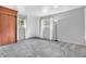 Spacious bedroom featuring freshly cleaned carpet, two windows, and freshly painted walls at 3201 Chamberlin Dr, Indianapolis, IN 46227