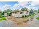 Exterior of the house with a large driveway and well-kept lawn at 3201 Chamberlin Dr, Indianapolis, IN 46227