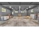Spacious, well-lit garage with painted walls and ample room for storage and projects at 3201 Chamberlin Dr, Indianapolis, IN 46227