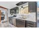 Stylish kitchen with stainless steel appliances, marble countertops and tiled floors at 3201 Chamberlin Dr, Indianapolis, IN 46227