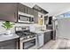 Modern kitchen featuring stainless appliances, marble counters, and ample storage at 3201 Chamberlin Dr, Indianapolis, IN 46227