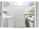 Bright laundry room featuring modern appliances and convenient built-in shelving at 3201 Chamberlin Dr, Indianapolis, IN 46227