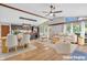 Staged open concept living space and dining area with modern decor at 3201 Chamberlin Dr, Indianapolis, IN 46227