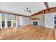 Bright living room with hardwood floors and a stone fireplace at 3201 Chamberlin Dr, Indianapolis, IN 46227