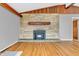 Spacious living room features a stone fireplace and hardwood floors at 3201 Chamberlin Dr, Indianapolis, IN 46227