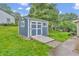 Outdoor shed with double doors, providing extra storage space in the backyard at 3201 Chamberlin Dr, Indianapolis, IN 46227