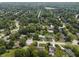 An aerial view of the neighborhood featuring tree-lined streets with well-kept houses and greenery at 321 4Th E Ct, Carmel, IN 46033