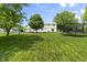 An inviting backyard with mature trees and a play area offers a private outdoor space at 321 4Th E Ct, Carmel, IN 46033