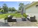 Outdoor patio setting is perfect for entertaining, with comfortable seating and a striped rug at 321 4Th E Ct, Carmel, IN 46033