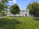 This large backyard has a playhouse, trampoline and ample green space, great for recreation at 321 4Th E Ct, Carmel, IN 46033