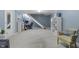 Finished basement area with comfortable seating, a desk, and shelving, perfect for relaxing and entertaining at 321 4Th E Ct, Carmel, IN 46033