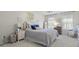 Bright bedroom with neutral walls, plush carpeting, and a comfortable bed with stylish decor at 321 4Th E Ct, Carmel, IN 46033