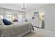 Comfortable bedroom with a well-lit interior, soft carpet, and stylish furnishings at 321 4Th E Ct, Carmel, IN 46033