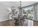Well decorated dining room with rustic table set, chandelier and large bright window at 321 4Th E Ct, Carmel, IN 46033