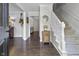Open foyer with staircase and view into the living spaces at 321 4Th E Ct, Carmel, IN 46033