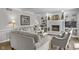 Spacious living room featuring a fireplace, built-in shelving, and comfortable furniture for relaxation at 321 4Th E Ct, Carmel, IN 46033