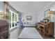 Inviting living room with lots of natural light, piano and hardwood floors at 321 4Th E Ct, Carmel, IN 46033