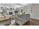 Bright living room boasts a brick fireplace, built-in shelving, and sliding glass doors to the backyard at 321 4Th E Ct, Carmel, IN 46033