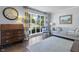 Bright living room with large windows, hardwood floors, and comfortable seating at 321 4Th E Ct, Carmel, IN 46033