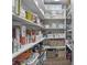 Walk-in pantry with organized shelving, offering plenty of space for food storage and kitchen essentials at 321 4Th E Ct, Carmel, IN 46033