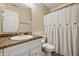 Bathroom featuring a white vanity with a solid surface counter, toilet, and shower with decorative curtain at 34 Westview Pl, Bargersville, IN 46106
