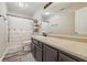 Well-lit bathroom with modern fixtures, a large mirror, and dark cabinets with light countertop at 34 Westview Pl, Bargersville, IN 46106