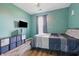 Modern bedroom with updated fixtures, wood floor, wall-mounted TV, and neutral-color accents at 34 Westview Pl, Bargersville, IN 46106