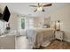 Serene main bedroom with a large bed, wood floors, natural light, and light walls at 34 Westview Pl, Bargersville, IN 46106
