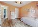 Bright bedroom with hardwood floors, white trim, and a single bed at 34 Westview Pl, Bargersville, IN 46106