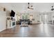 Spacious living room with fireplace, dark floors, and ample natural light at 34 Westview Pl, Bargersville, IN 46106