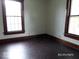 Bedroom with dark hardwood floors and two large windows providing natural light at 340 W 11Th St, Anderson, IN 46016