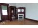 Cozy living room featuring hardwood floors and a classic fireplace at 340 W 11Th St, Anderson, IN 46016