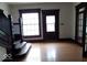 Inviting living area with wood floors, staircase, and natural light at 340 W 11Th St, Anderson, IN 46016
