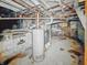 Unfinished basement with water heater and exposed piping at 3526 E Vermont St, Indianapolis, IN 46201