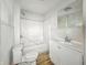 Bathroom with shower, sink, toilet and a light at 3526 E Vermont St, Indianapolis, IN 46201