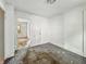 Vacant bedroom featuring interior doors and an overhead light at 3526 E Vermont St, Indianapolis, IN 46201