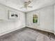 Vacant bedroom with ceiling fan and a view to the backyard at 3526 E Vermont St, Indianapolis, IN 46201