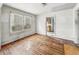 Living room featuring hardwood floors, window and view to kitchen at 3526 E Vermont St, Indianapolis, IN 46201