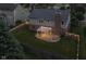 Aerial view of backyard featuring a pergola, fire pit, manicured lawn, and fenced yard with string lights at 4650 Blue Marlin Way, Indianapolis, IN 46239