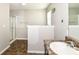Bathroom showcasing a walk-in shower with glass doors and a tiled floor at 4650 Blue Marlin Way, Indianapolis, IN 46239