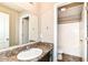 Bright bathroom featuring a large mirror, modern vanity and a shower-tub combination at 4650 Blue Marlin Way, Indianapolis, IN 46239