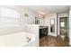This primary bath includes a soaking tub and separate vanity at 4650 Blue Marlin Way, Indianapolis, IN 46239