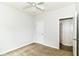 This cozy bedroom has carpet floors, a ceiling fan, and an access door to the bathroom at 4650 Blue Marlin Way, Indianapolis, IN 46239