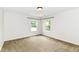 Bright bedroom featuring neutral carpeting and natural light from two windows at 4650 Blue Marlin Way, Indianapolis, IN 46239