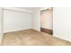 Carpeted bedroom with an entryway leading to a room with hardwood floors at 4650 Blue Marlin Way, Indianapolis, IN 46239